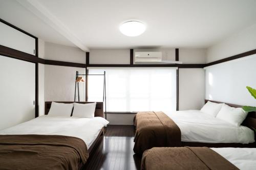 Katil atau katil-katil dalam bilik di APRO STAY Denenchofu Tamagawa