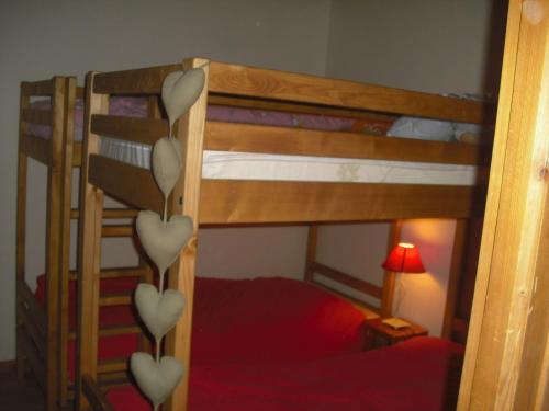 a bedroom with two bunk beds with hearts on them at Appartement Les Gets, 3 pièces, 6 personnes - FR-1-671-133 in Les Gets
