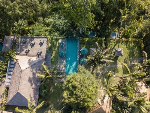an aerial view of a resort with a swimming pool at The Hidden Paradise Ubud - CHSE Certified in Ubud