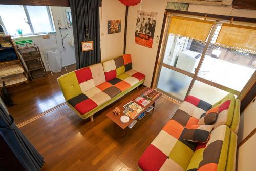 Ruang duduk di コザを楽しむ一軒家 Kaeruhouse