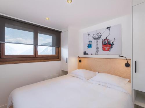 Katil atau katil-katil dalam bilik di Appartement lumineux 50m² au centre de Courchevel Village, proche des pistes et commerces - FR-1-562-77