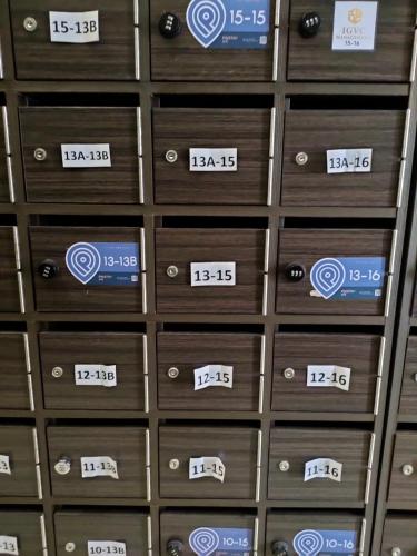 a row of wooden drawers with numbers on them at D'Aqiela Homestay @ ITCC in Penampang