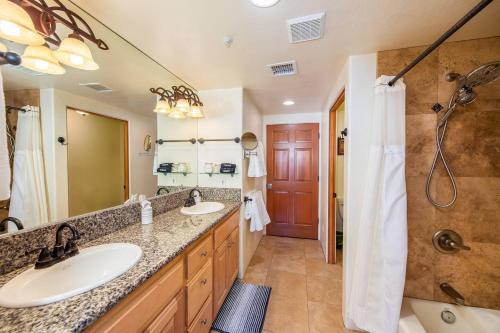 a bathroom with two sinks and a shower at Uptown Sedona Gem: 3-Bed Townhome with Majestic Views and Central Location in Sedona