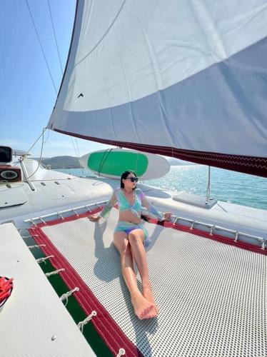 a woman in a bikini sitting on a boat at Silver Beach 3br Sea View Pool&Wine Private Villa in Chaweng