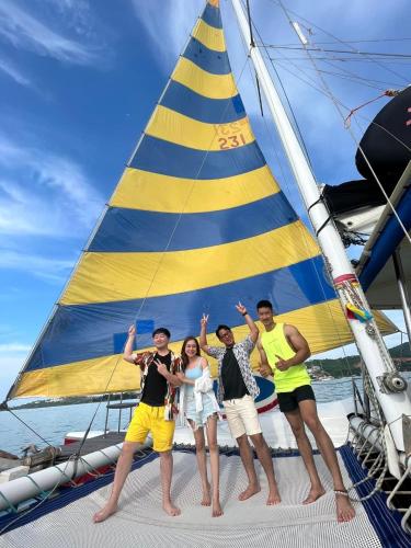 a group of people standing on a sailboat at Silver Beach 3br Sea View Pool&Wine Private Villa in Chaweng