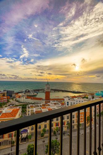 a view of a city from a balcony at Nexus House Ocean front & Hillside Phú Quốc in Phu Quoc