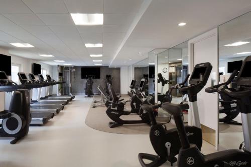 a gym with rows of treadmills and elliptical machines at The Westin Riverwalk, San Antonio in San Antonio