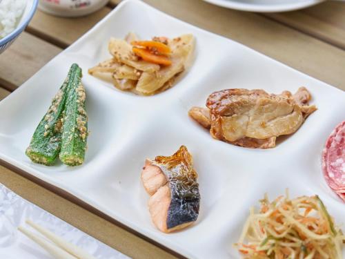 a white plate with different types of food on it at Hakone Yumoto hotel in Hakone