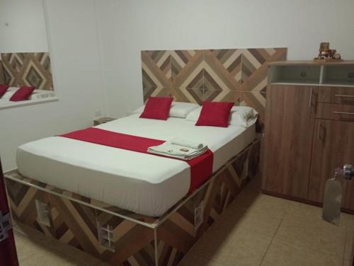 Postel nebo postele na pokoji v ubytování Hostal Kumbaya