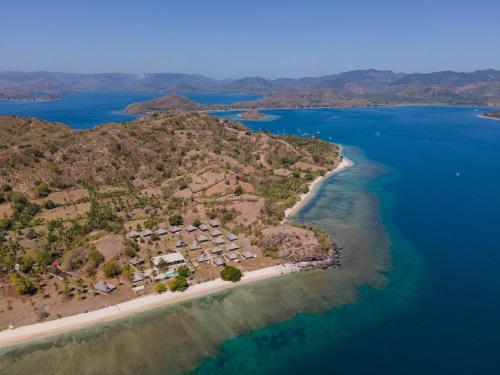 an aerial view of an island in the ocean at Bleu MATHIS Gili Asahan in Gili Asahan
