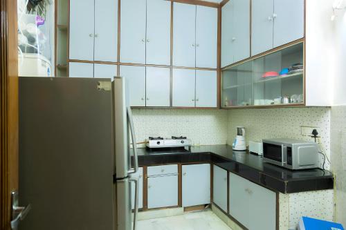Kuchyň nebo kuchyňský kout v ubytování Woodpecker Apartments Hauz khas