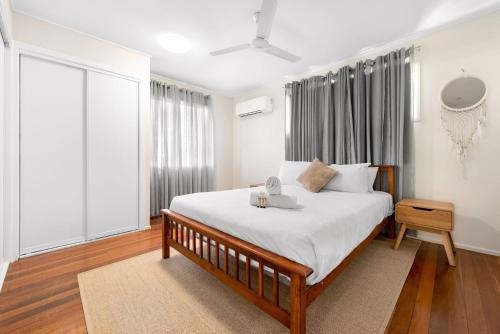 a bedroom with a large bed and a window at Rosie's in Woody Point