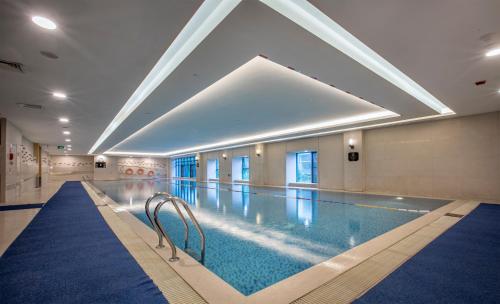 a large swimming pool in a building at Hilton Xi'an in Xi'an