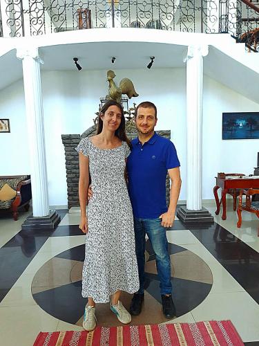a man and a woman standing in a room at Ceylon Breeze in Kandy