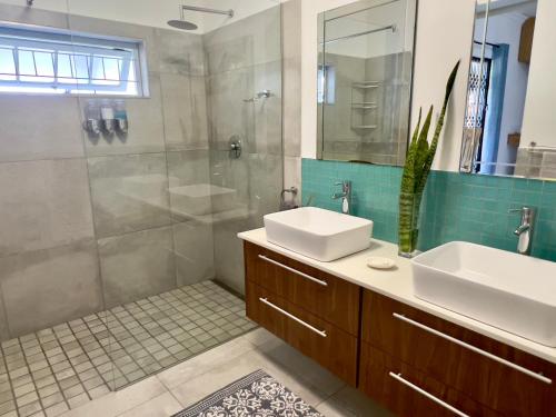 a bathroom with a sink and a shower at Always Summer Guesthouse in Langebaan