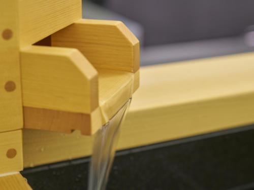 a close up of a wooden leg of a table at Villa Fontaine Grand Osaka Umeda in Osaka