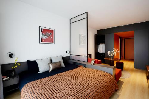 a bedroom with a bed and a large mirror at base-Beijing Wangfujing Serviced Apartment in Beijing