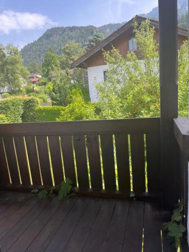a wooden porch with a view of a mountain at Ferienhaus Reseda in Bayerisch Gmain