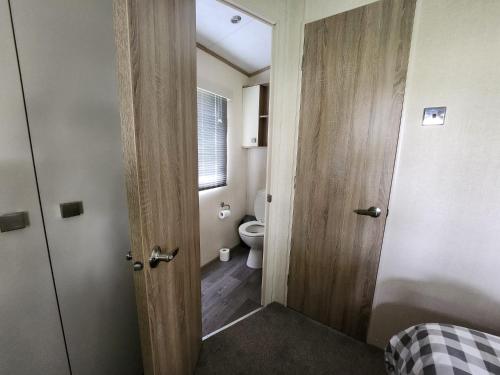 an open door to a bathroom with a toilet at D&A's Short Breaks - St Margarets Bay, Dover in St Margarets at Cliff