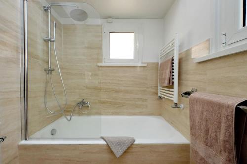 a bathroom with a shower and a bath tub at On The Steps in Rome