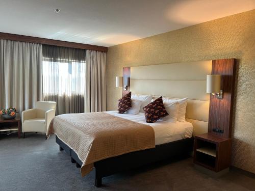 Ένα ή περισσότερα κρεβάτια σε δωμάτιο στο Van der Valk Hotel Rotterdam - Blijdorp