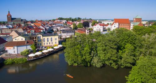 an aerial view of a city with a river at Gościniec & SPA Darłowo in Darłowo