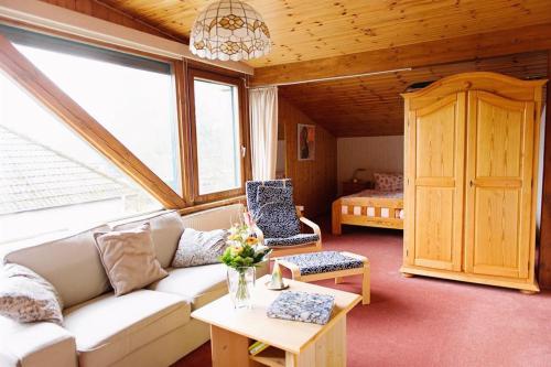 a living room with a couch and a table at StockerHenke in Soltau