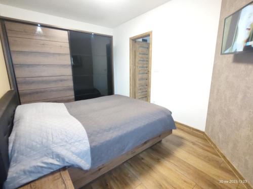 Кровать или кровати в номере Darłówko Apartament Morski XIII