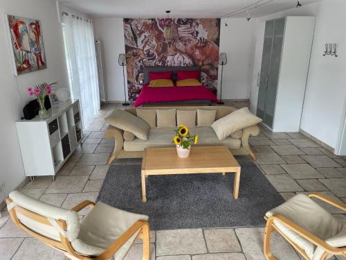 a living room with a couch and a bed at Ferienwohnung Berens in Cochem