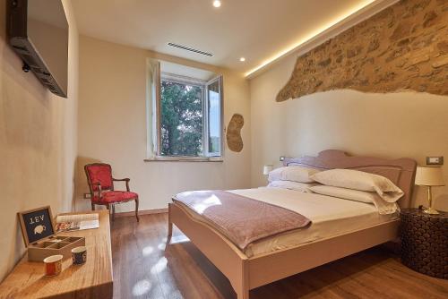 Ένα ή περισσότερα κρεβάτια σε δωμάτιο στο Croce di mezzo