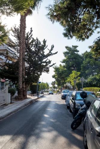 a street with cars parked on the side of the road at V.L.A Apartments by the sea in Vari