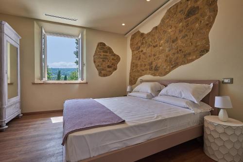 Ένα ή περισσότερα κρεβάτια σε δωμάτιο στο Croce di mezzo