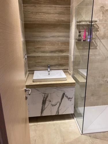 a bathroom with a sink and a shower at Il monte galala in Ain Sokhna