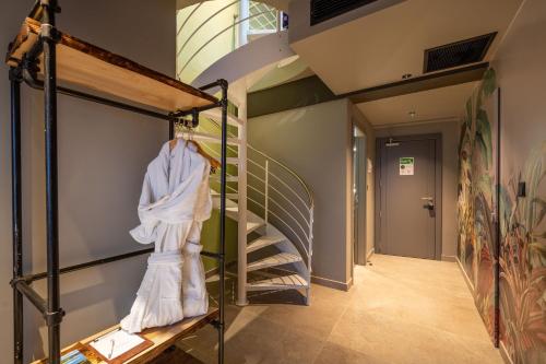 a hallway with a staircase in a house at Salini Suites in Żebbuġ