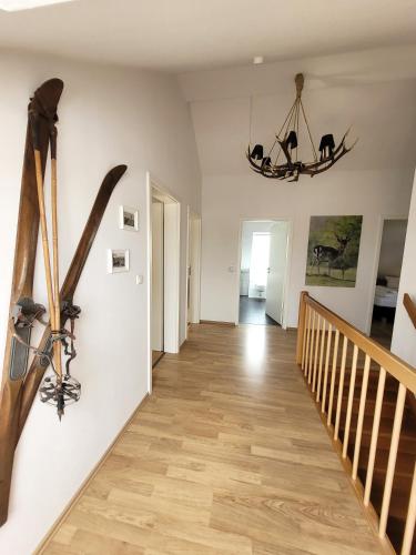 a hallway of a home with skis on the wall at Winterberg Chalet 21096 in Winterberg