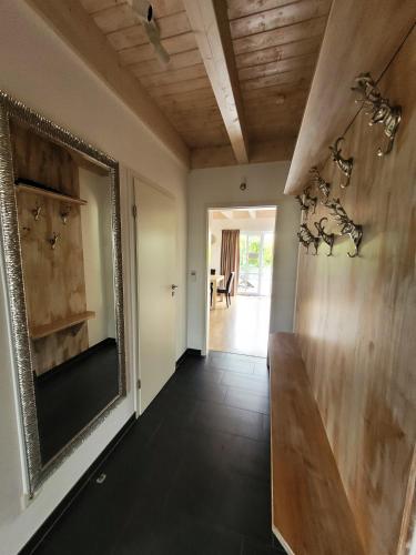 a hallway with a large mirror on the wall at Winterberg Chalet 21096 in Winterberg