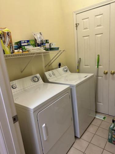 a laundry room with a washer and dryer at 2 BR Condo W/ Golf Cart & Pool (Pet-Friendly) in Myrtle Beach