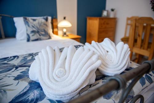a group of towels sitting on top of a bed at Residence Hattrick in Prague