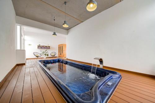 a swimming pool in the middle of a room at Villa Goa - By Luxury Villas Malta in Mellieħa