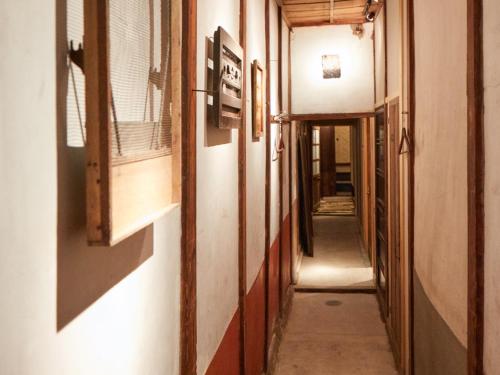 a hallway of a building with a hallway at sakainoma hotel 熊 in Sakai