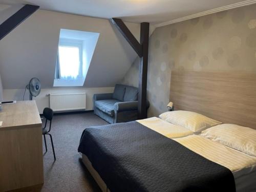 Postel nebo postele na pokoji v ubytování Hotel U Dvou medvídků