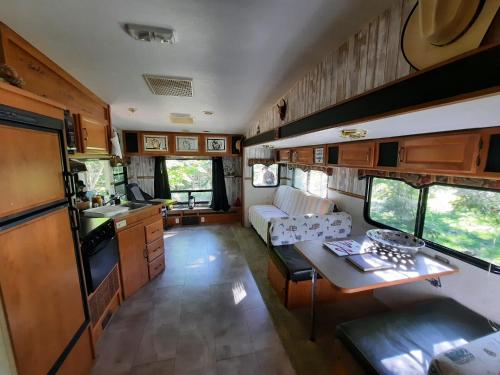 a kitchen and living room of an rv at Ranch vdv in Thetford Mines