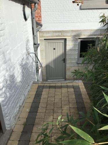 a door in the side of a house at Black and white in Profondeville