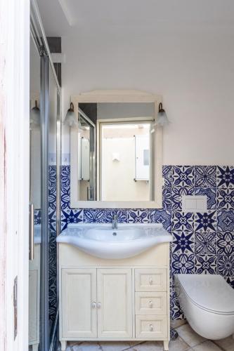a bathroom with a sink and a mirror at Casa Mimina in Ischia