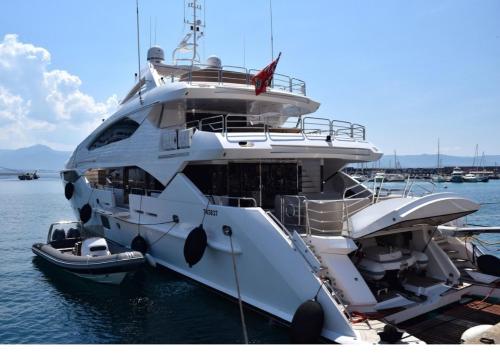 a large white yacht is docked in the water at AVC Tur in Istanbul