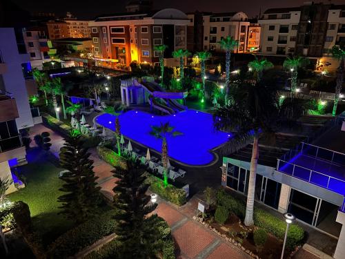 an aerial view of a pool at night at Penthouse 4 bedrooms, 1 living room, to the sea 7 minutes walk in Alanya