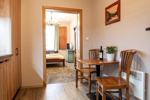 a room with a table and chairs and a dining room at Residence Hattrick in Prague