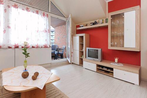 Un televizor și/sau centru de divertisment la Ferienwohnung Inselblick