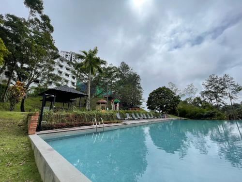 a large swimming pool in front of a building at Cosy Music Home at Genting View Resort 3R2B 9pax by Jen dehome in Genting Highlands