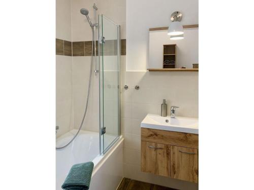 a bathroom with a shower and a sink at Borlaser-Landhaus in Borlas